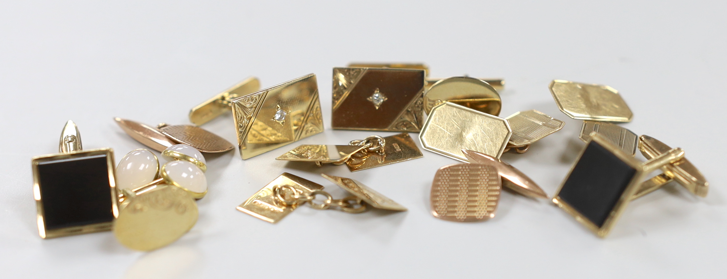 Six assorted modern pairs of 9ct gold cufflinks including diamond chip set and one other yellow metal and cabochon set cufflinks, gross weight 39.2 grams.